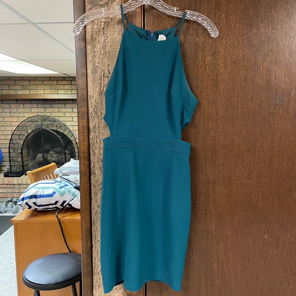 Teal mini dress with side cut outs and high neck line